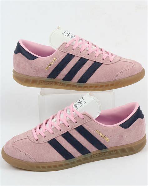 pink adidas with blue stripes